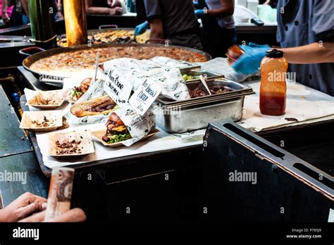 Street food sold in a local market Stock Photo - Alamy